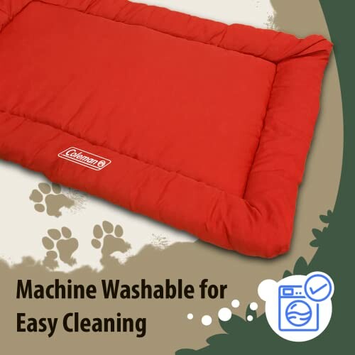 Red dog bed with machine washable feature and paw print design.